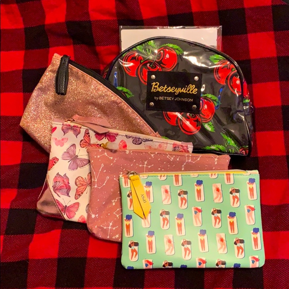 Betseyville make-up bag with several ipsy bags.